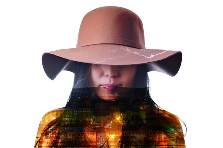 Double exposure portrait of a woman combined with a picture of night city viewの写真素材