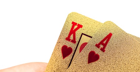 Golden playing poker cards on white backgroundの写真素材