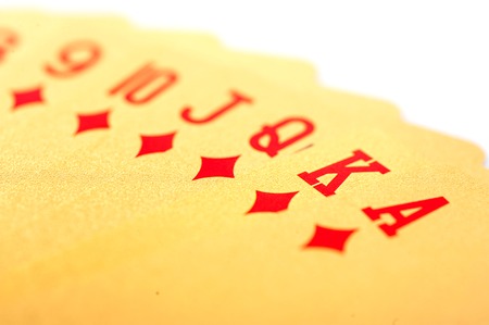 Golden playing poker cards on white backgroundの写真素材