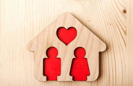 Little wooden house with couple inside of itの写真素材