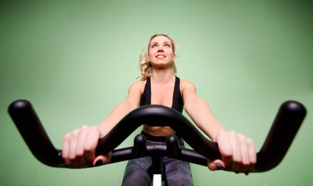 Young beautiful woman works out in the gymの写真素材
