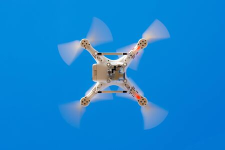 Hovering drone that takes pictures of city sightsの写真素材