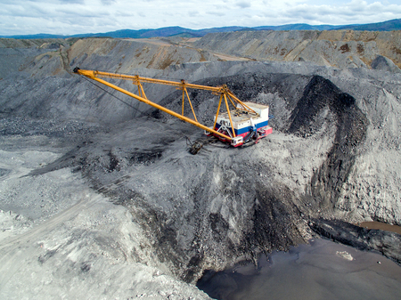 Dragline on open pit coal mine in Russia