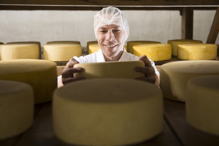 Producing fresh cheese at factory in Russia