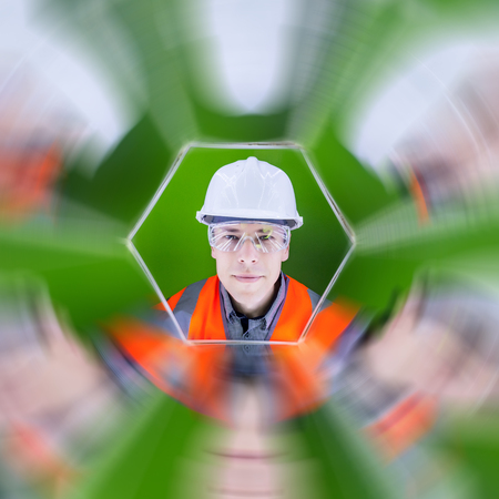 Portrait of a male worker reflected in the mirrows