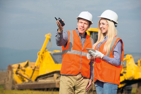 construction co-workers discussing about work plan construction siteの写真素材