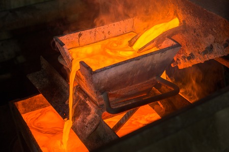 Casting gold at a factory. Gold mining.の写真素材