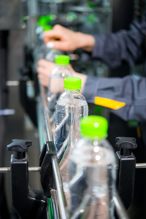 Conveyor with water bottlesの写真素材