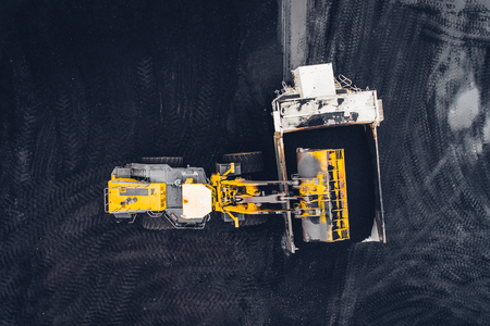 Coal mining at an open pit from above.