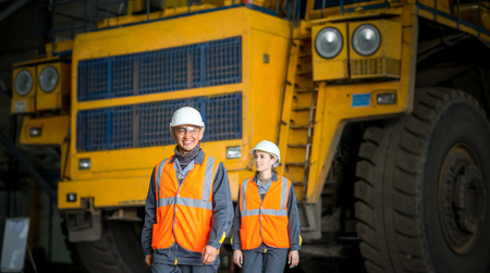 Worker in front of a bug truck