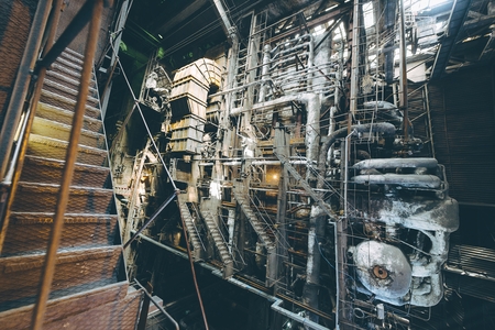 Giant pipes, tubes and equipment inside modern industrial power plantの写真素材