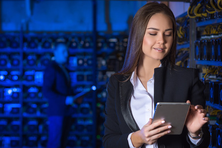 Beautiful woman at mining farmの写真素材