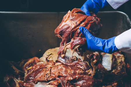 Man hand holding the raw meat