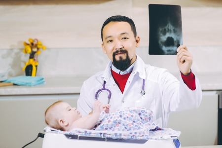 doctor examining x-ray pictureの写真素材