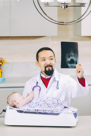 doctor examining x-ray pictureの写真素材