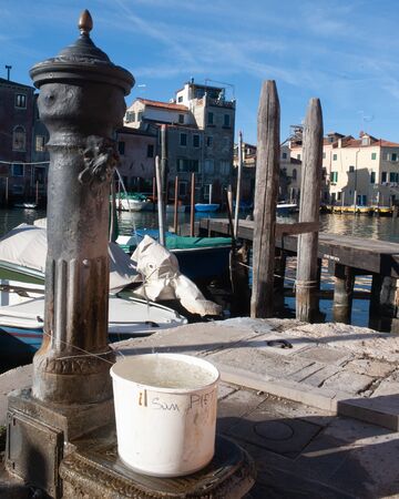 Medieval water standpipe in Veniceの写真素材