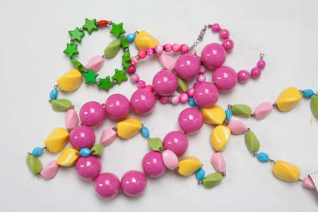 several colored decorations on light background