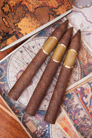 Three cigar lying on a colorful backgroundの写真素材