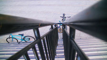 bicycles are put in city parks in portraits of iron stairsの写真素材