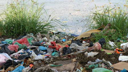 River that is polluted with various garbage and trash, Polluted rivers, photographyの写真素材