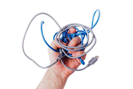 hand full of cables for computer equipment isolated on white