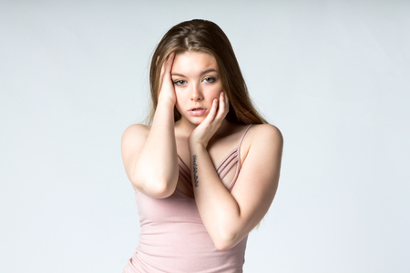 Beautiful young model posing for fashion photoshoot in studioの写真素材