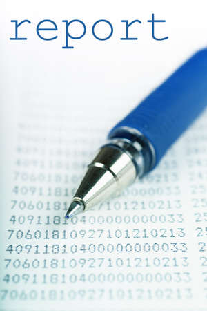 Macro view of blue pen on a report with many digitsの写真素材