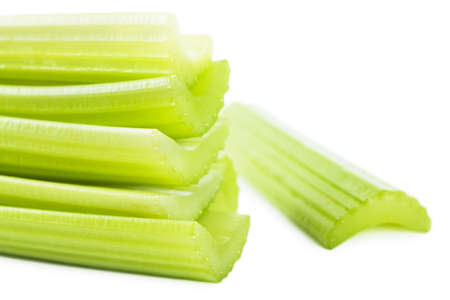 Fresh green stems of celery over white backgroundの写真素材