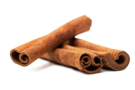 Cinnamon sticks spice isolated over white backgroundの写真素材