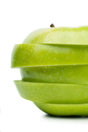 Sections of fresh ripe green apple isolated over white background  Diet conceptの写真素材