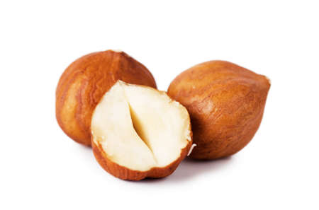 Closeup view of hazelnuts over white backgroundの写真素材