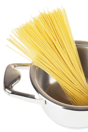 Bunch of spaghetti in a pot isolated over white backgroundの写真素材