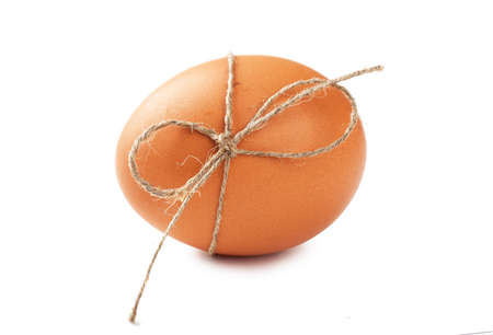 Macro view of brown egg isolated on the whiteの写真素材