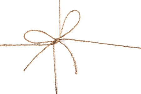 Closeup view of string knot over white backgroundの写真素材