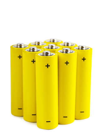 Bunch of yellow batteries isolated over white backgroundの写真素材