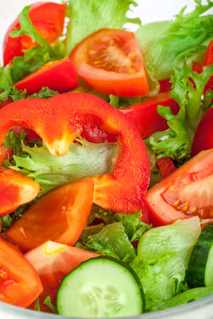 Fresh salad with tomatos cucumbers and peppersの写真素材