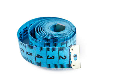 Closeup view of blue measuring tape isolated over white backgroundの写真素材