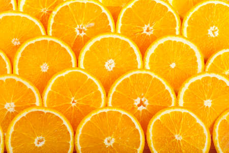 Abstract background with fresh juicy orange slicesの写真素材