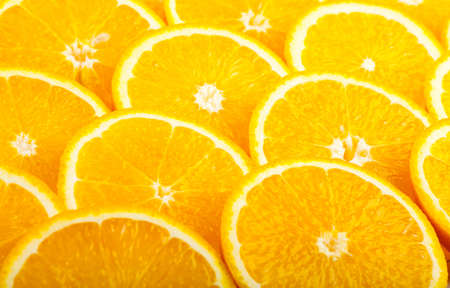Abstract background with fresh juicy orange slicesの写真素材