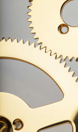 Macro view of two golden gears