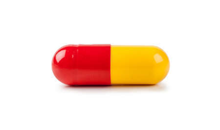 Macro view of capsule pill isolated over white background