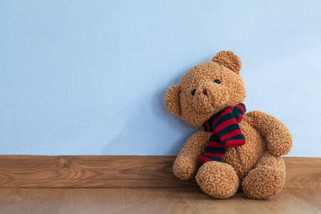 Single teddy bear on a floor in a child roomのeditorial素材