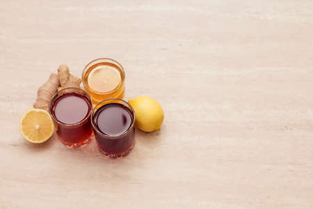 drinks of different colours and textures in glass cups on table on  light background. A place for a label. Copyspaceの写真素材