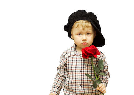 Cute baby with a rose in his hands.の写真素材