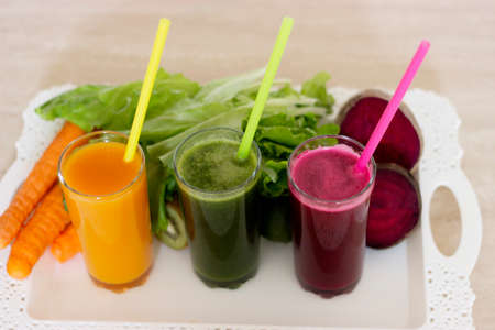 Vegetable smoothies detox - Carrot, beet and green salad. Vegetarian Organic Food. Freshly squeezed juice cocktail. Closeupの写真素材
