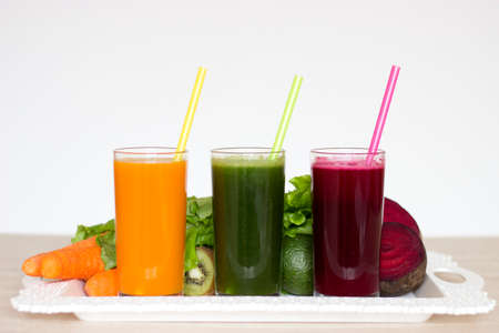 Vegetable smoothies detox - Carrot, beet and green salad. Vegetarian Organic Food. Freshly squeezed juice cocktail. Copyspaceの写真素材