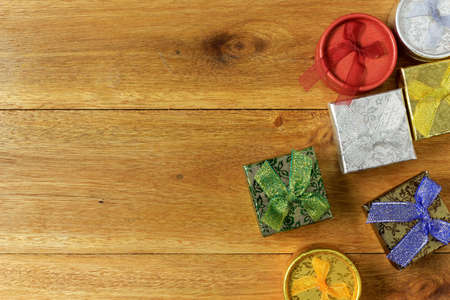 Christmas composition. Christmas gifts on wooden table. Top view, empty space, paper, cardboard