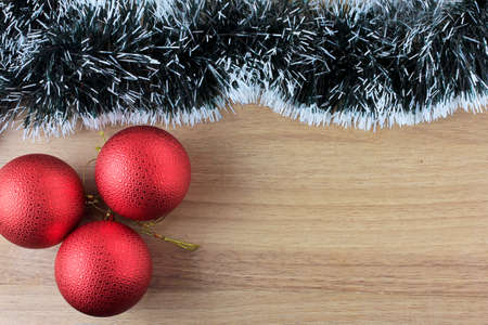 wooden background, christmas decoration with balls and gifts, decorative tree branches, front viewの写真素材