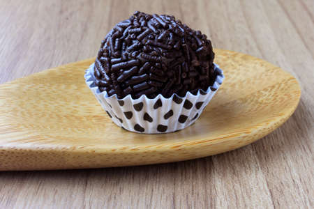 brigadeiro (brigadier), sweet chocolate typical of Brazilian cuisine covered with particles, in a...