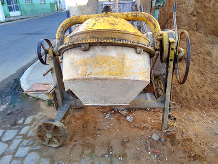 concrete mixer at the construction site ready to mix cement. Closeupの写真素材